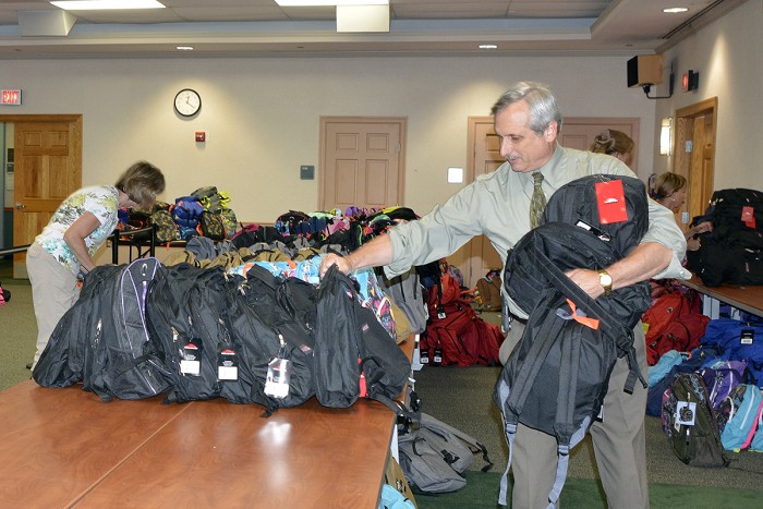 CSM folks pack 1500 backpacks with supplies for local students